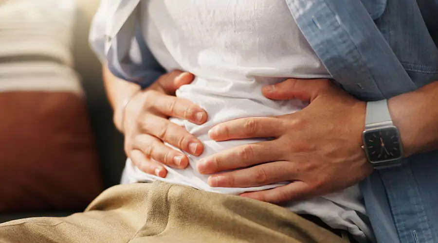 A functional medicine practitioner reviewing the gut-brain connection chart, highlighting the link between gut health and anxiety.