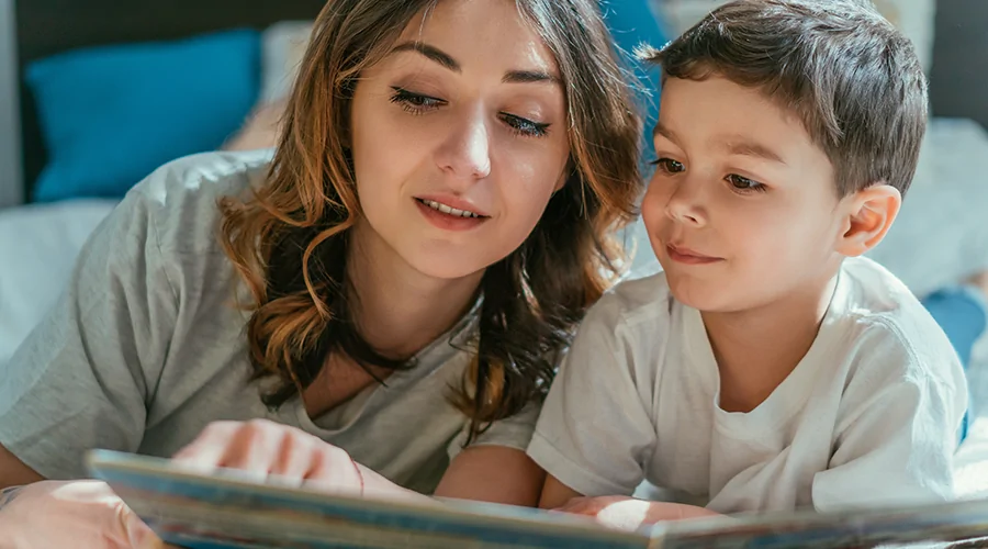 Woman teaching a boy