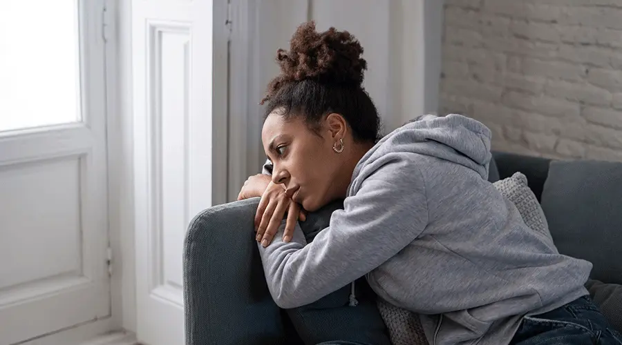 Woman reviewing lab results and health notes during a functional health consultation.