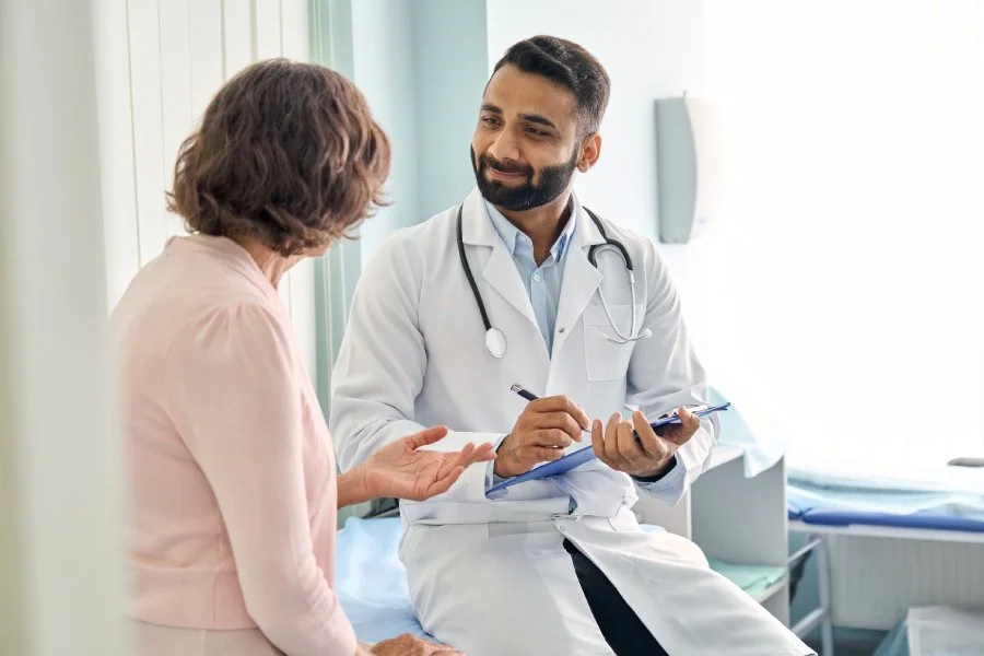 Patient reviewing mold illness and CIRS testing with a functional medicine provider.
