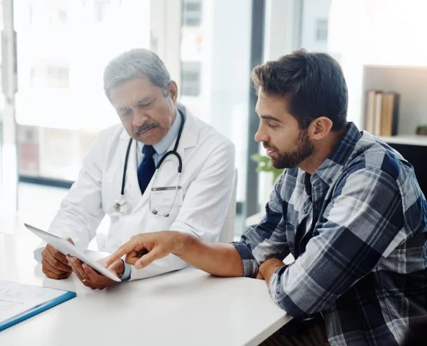 Physician discussing low libido treatment options with a male patient.